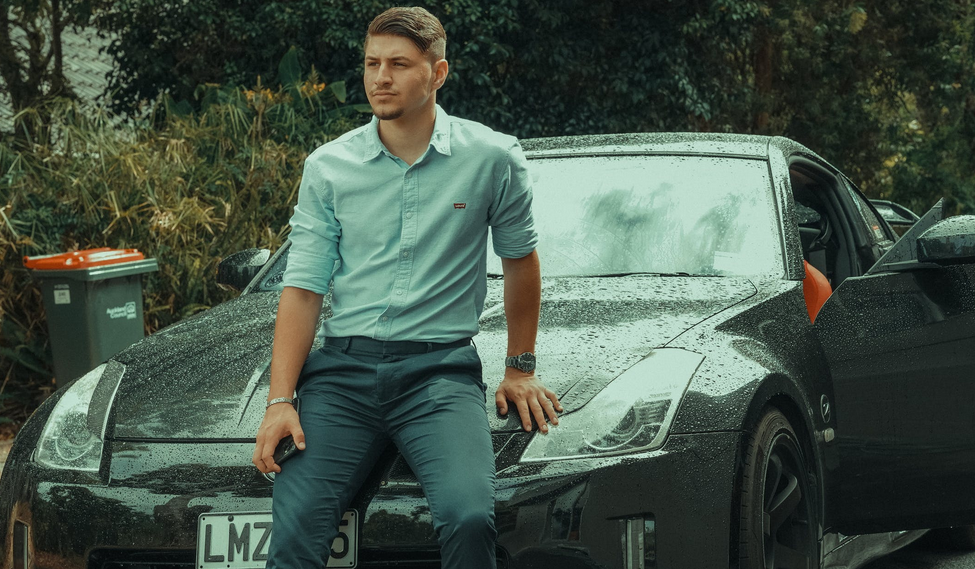 man with black car